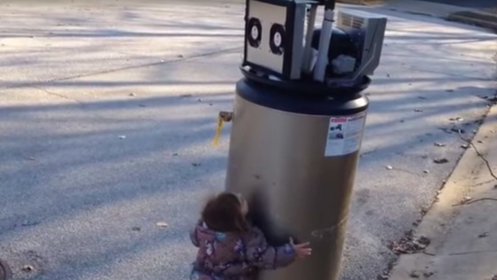 articles/2017/03/28/cute-kid-confuses-water-heater-for-robot/170328-Kid-robot-tease_vsss7c