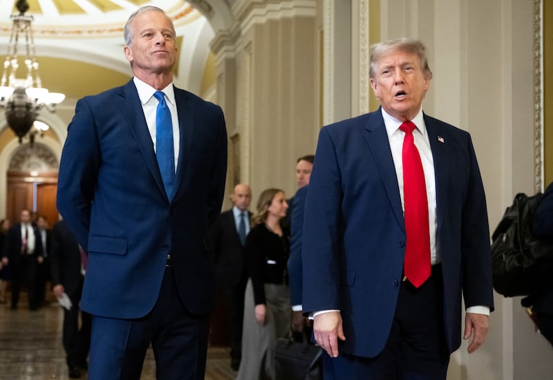 US President Donald Trump walks with Senate Majority Leader John Thune, Republican from South Dakota, on the way to a lunch meeting with Senate Republicans at the US Capitol in Washington, DC, on June 24, 2026. President Trump said Wednesday he will refuse to sign a landmark housing bill, passed by Congress with broad bipartisan support, until lawmakers approve legislation that would overhaul American elections and restrict voter registration. (Photo by SAUL LOEB / AFP via Getty Images)