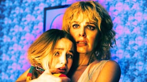 A photo illustration of Nell Fisher as Holly Wheeler and Cara Buono as Karen Wheeler in Stranger Things.