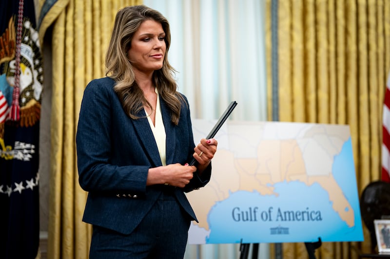 Lindsey Halligan, attorney for U.S. President Donald Trump, holds ceremonial proclamations to be signed by U.S. President Donald Trump