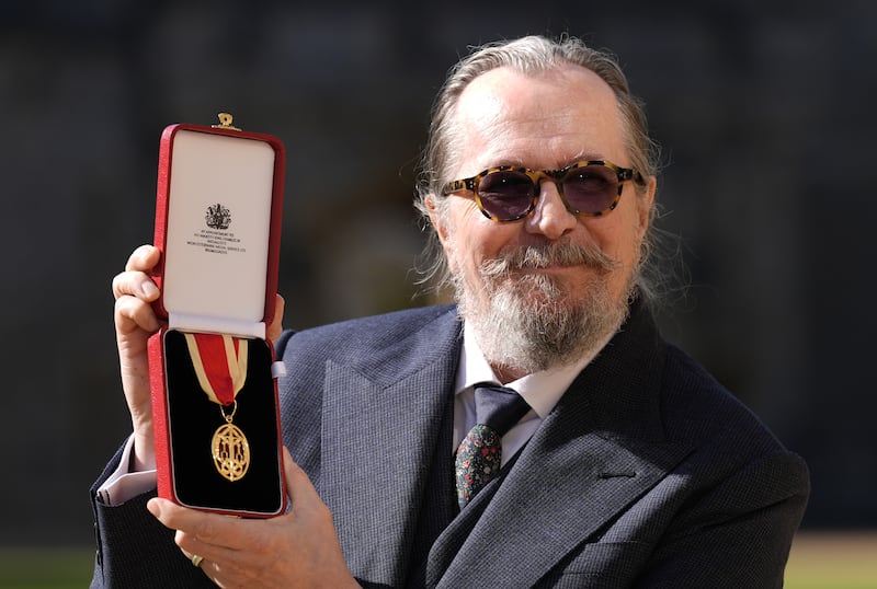WINDSOR, ENGLAND - SEPTEMBER 30: Sir Gary Oldman poses after being made a Knight Bachelor at an investiture ceremony at Windsor Castle on September 30, 2025 in Windsor, England. (Photo by Andrew Matthews-WPA Pool/Getty Images)