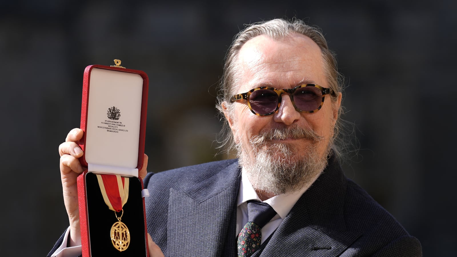 WINDSOR, ENGLAND - SEPTEMBER 30: Sir Gary Oldman poses after being made a Knight Bachelor at an investiture ceremony at Windsor Castle on September 30, 2025 in Windsor, England. (Photo by Andrew Matthews-WPA Pool/Getty Images)