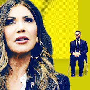 Kristi and Byron Noem with Corey Lewandowski in the background.