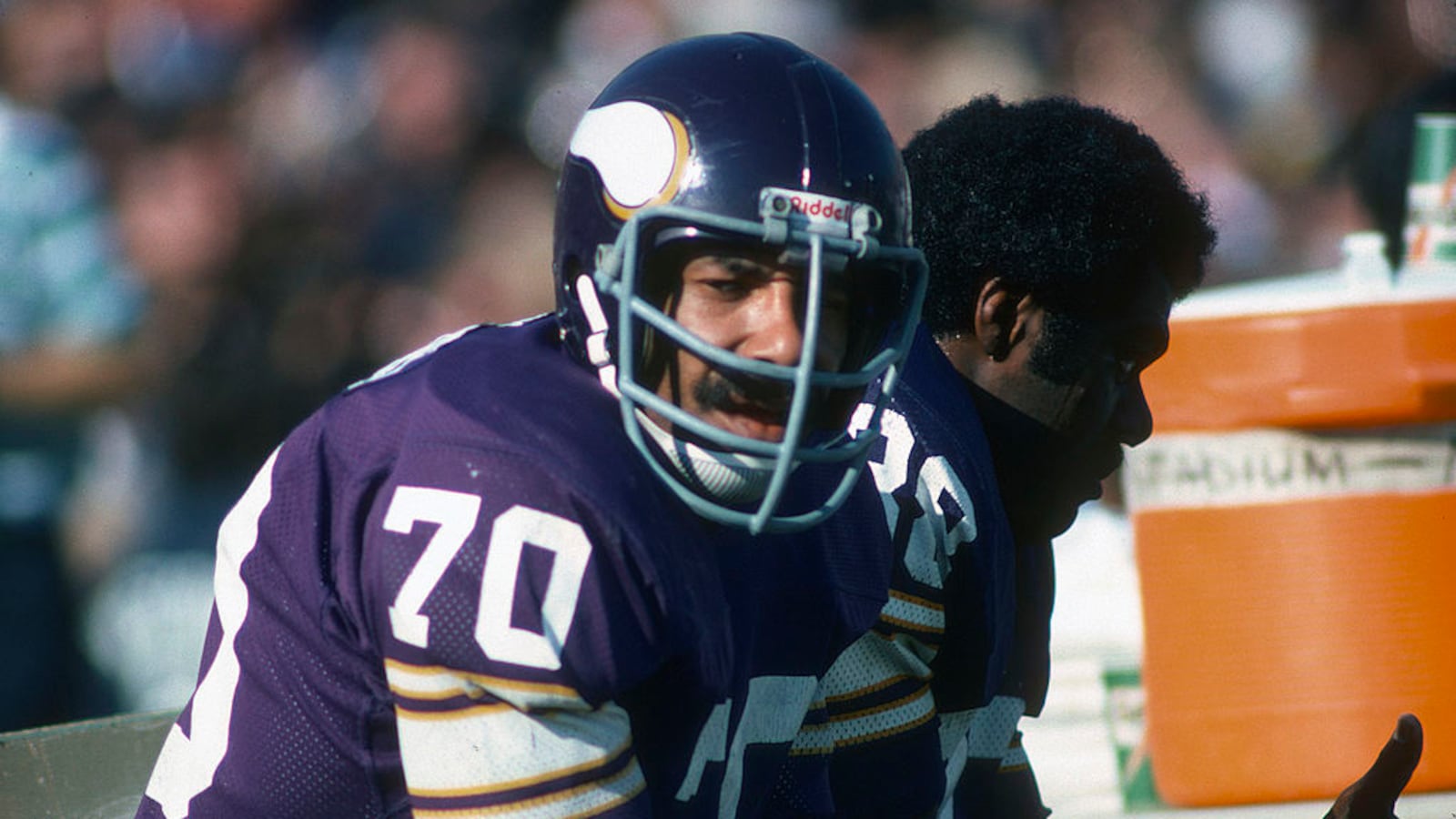 Jim Marshall #70 of the Minnesota Vikings looks on from the bench against the Oakland Raiders during Super Bowl XI on January 9, 1977