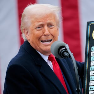 WASHINGTON, DC - APRIL 02: U.S. President Donald Trump holds up a chart while speaking during a “Make America Wealthy Again” trade announcement event in the Rose Garden at the White House on April 2, 2025 in Washington, DC. Touting the event as “Liberation Day”, Trump is expected to announce additional tariffs targeting goods imported to the U.S. (Photo by Chip Somodevilla/Getty Images)
