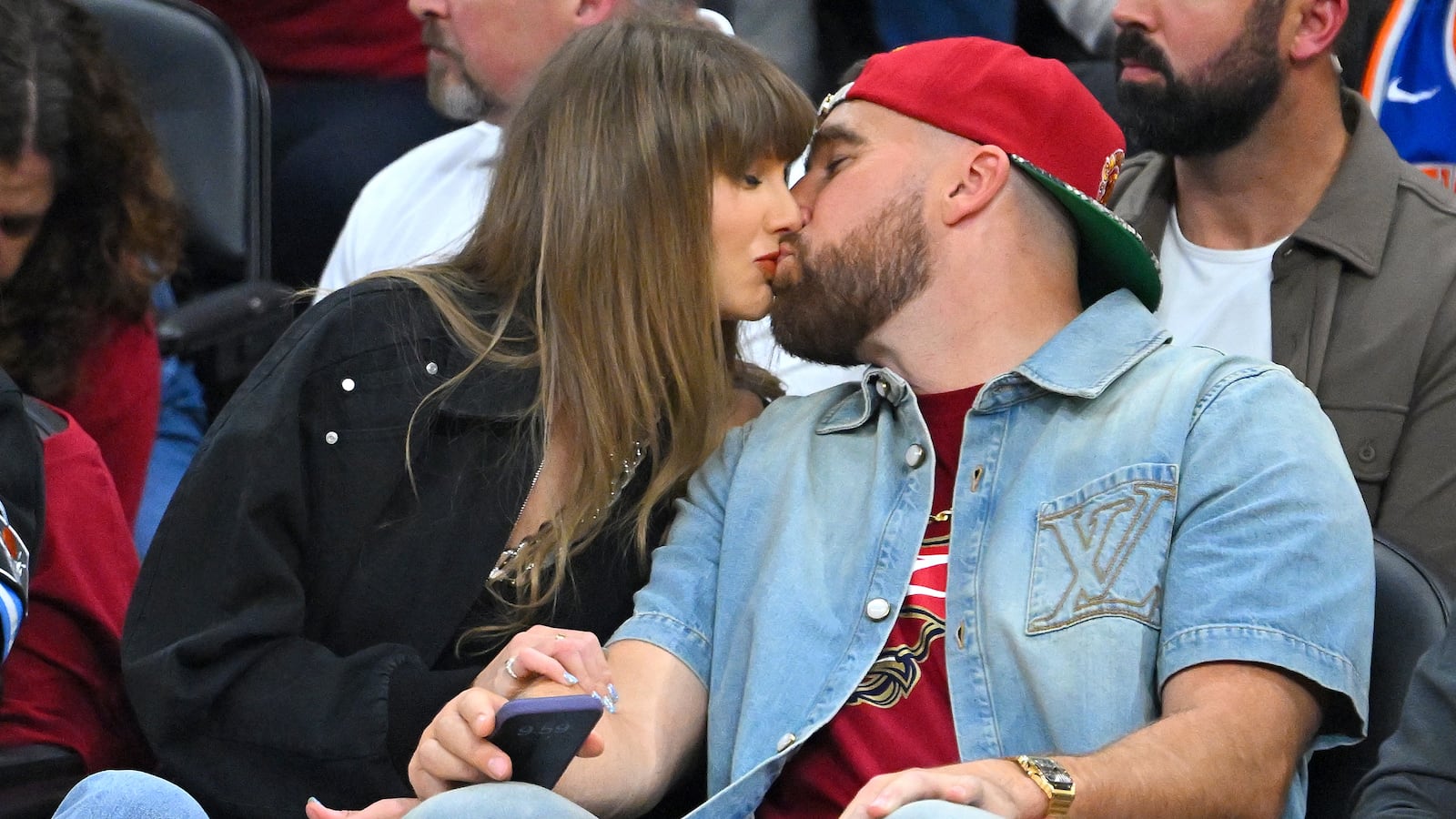 Taylor Swift and Travis Kelce pay no attention during Game Three between the New York Knicks and the Cleveland Cavaliers.