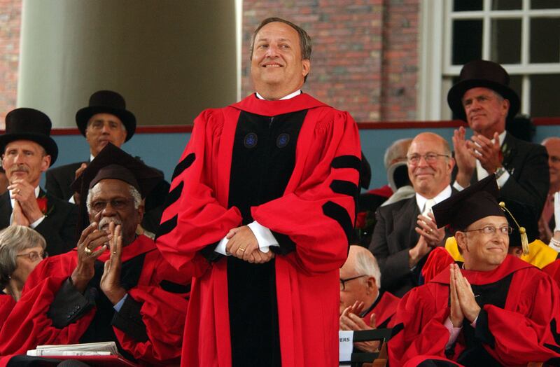 CAMBRIDGE, MA - JUNE 7: Former Harvard President Larry Summers receives applause from Microsoft co-founder and Chairman Bill Gates (R) and former NBA star Bill Russell (L) during commencement ceremonies at Harvard University June 7, 2007 in Cambridge, Massachusetts. Gates, who enrolled at Harvard in a pre-law program in 1973 and left in his junior year, received an honorary Doctor of Laws degree.