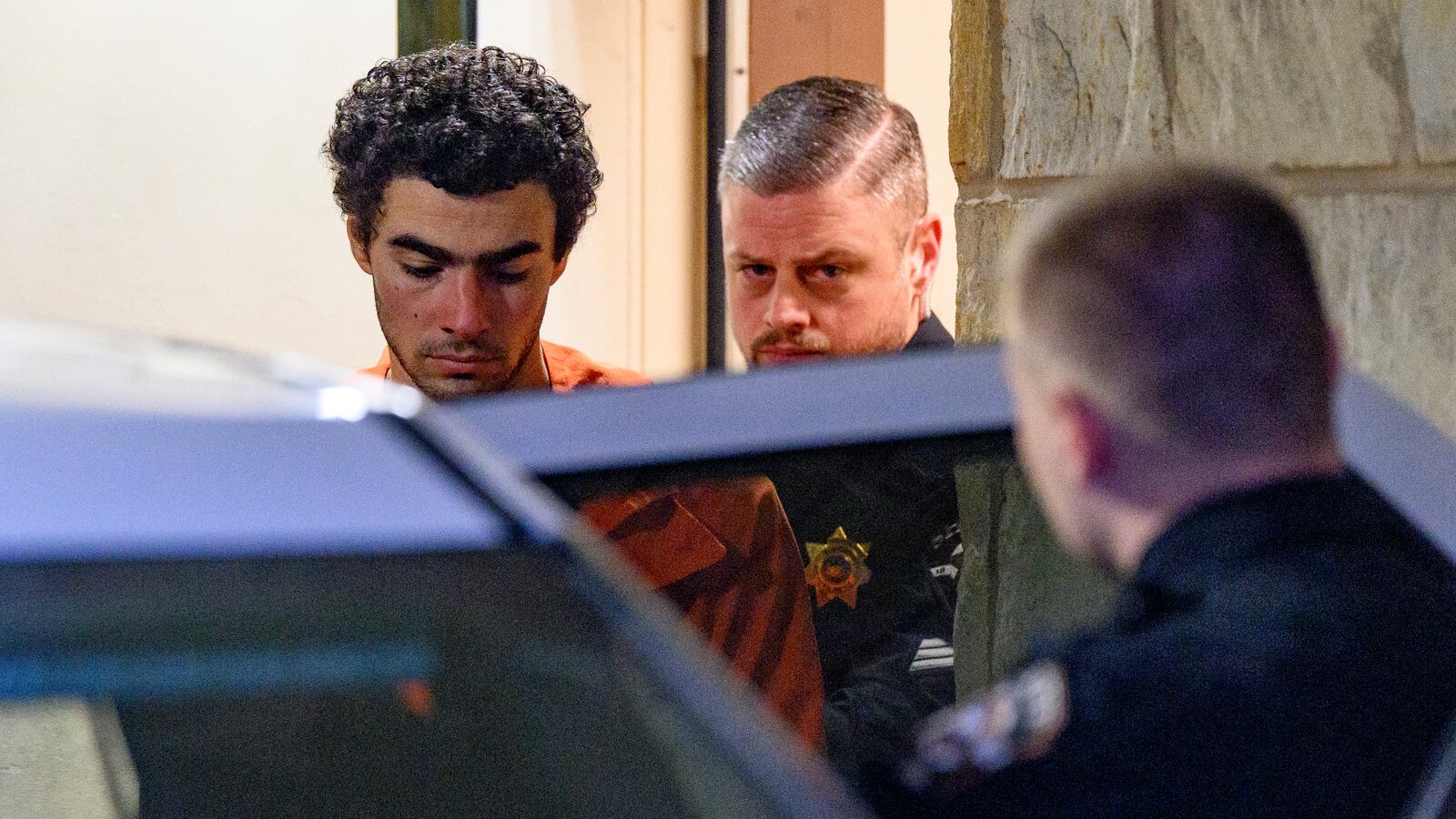 Suspected shooter Luigi Mangione is led from the Blair County Courthouse after an extradition hearing December 10, 2024 in Hollidaysburg, Pennsylvania.