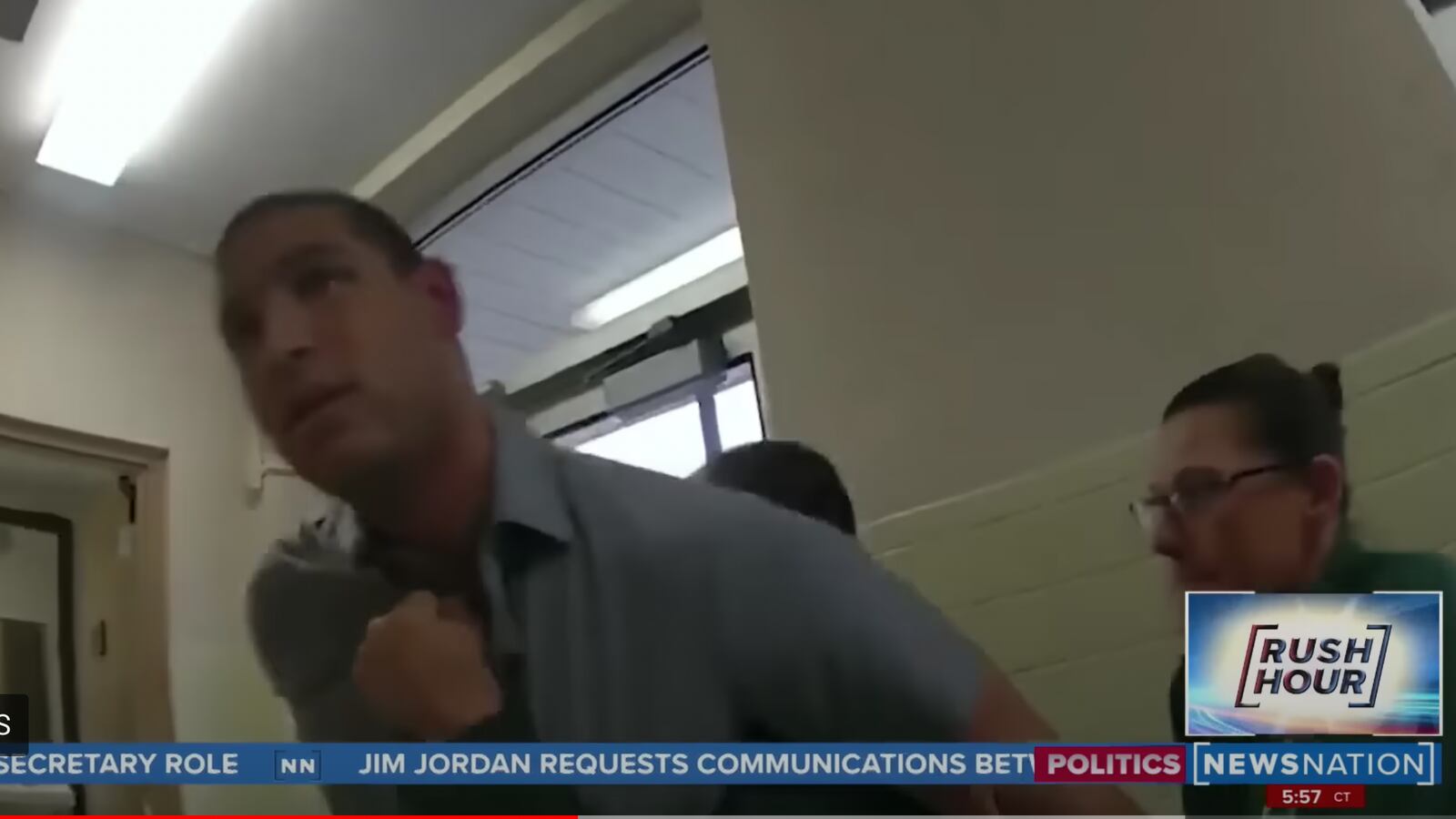 Evan Lambert is seen being arrested at an Ohio press conference for the train derailment in body camera footage.