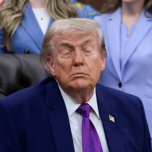 Trump shuts his eyes during Monday's Oval Office event.