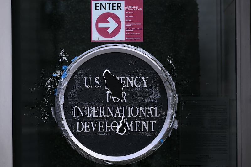 Remnants of signage for the US Agency for International Development (USAID) on the facade of the Ronald Reagan Building and International Trade Center building in Washington, DC, on December 29, 2025.