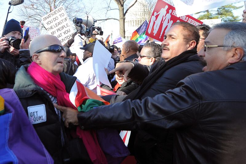 galleries/2013/03/26/scotus-marriage-equality-rallies/130326-marriage-equality-demonstrator-conflict_ap2lcv