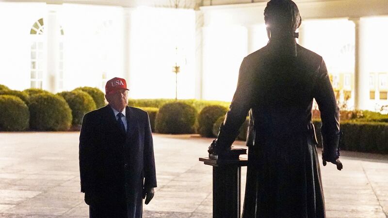 President Donald Trump looks at a newly installed statue of Thomas Jefferson as he returns to the White House, after Israel and the U.S. launched strikes on Iran, in Washington, D.C., on March 1, 2026.