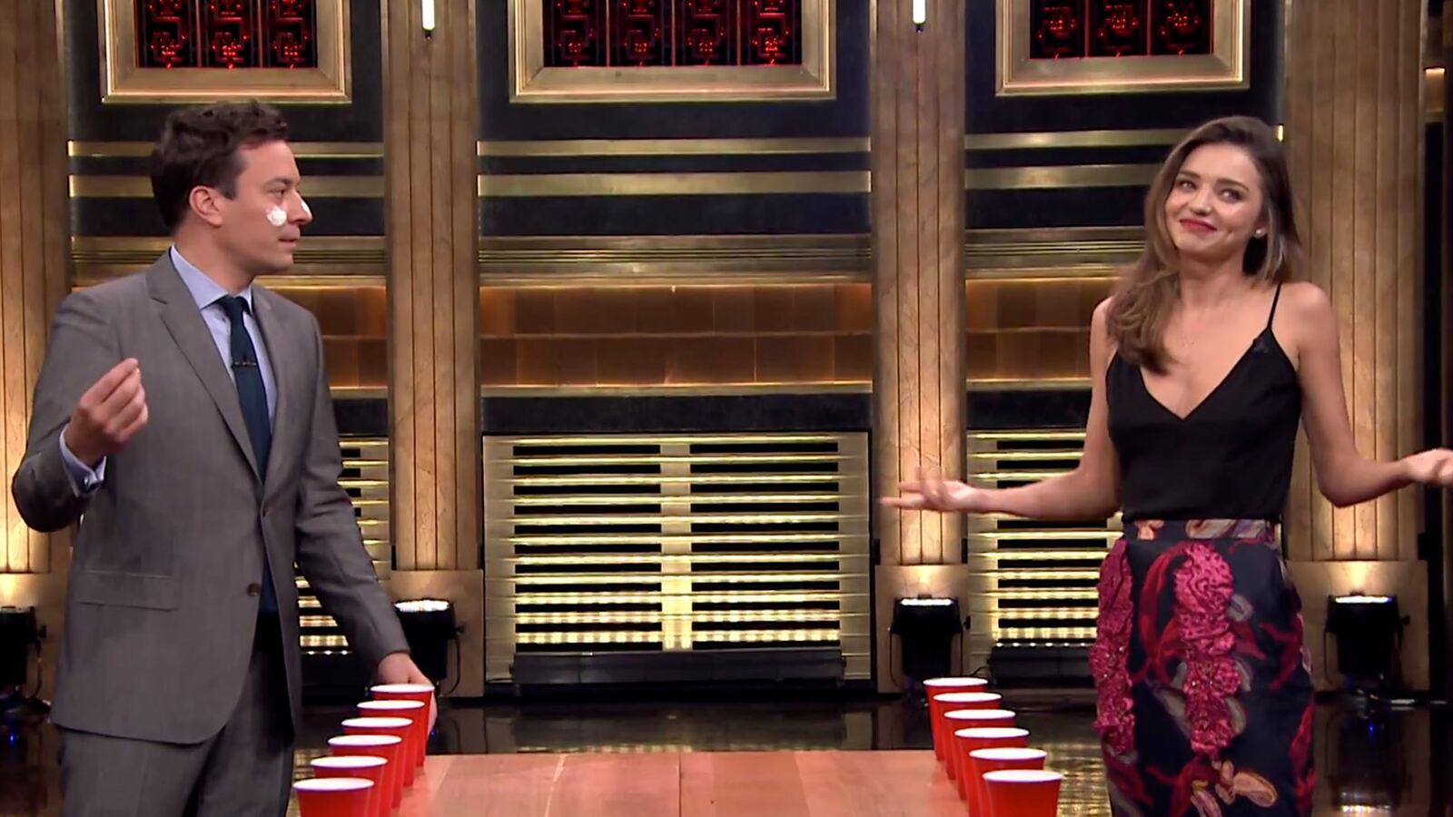 articles/2014/07/18/viral-video-of-the-day-miranda-kerr-plays-flip-cup-with-jimmy-fallon/140718-viralvid-flipcup-tease_nk2fuv