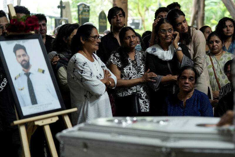 FILE PHOTO: Friends and family members mourn near the coffin of Co-Pilot Clive Kunder, who died after an AIR India Boeing 787-8 Dreamliner plane crashed during take-off from an airport in Ahmedabad, in Mumbai, India June 19, 2025. REUTERS/Hemanshi Kamani/File Photo
