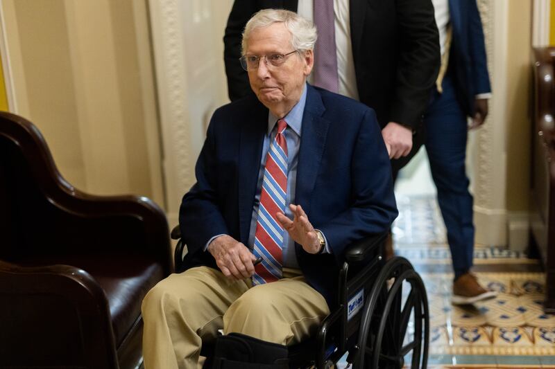 Senator Mitch McConnell (R-KY) departs a Senate Republican caucus luncheon inside the U.S. Capitol building in a wheelchair.