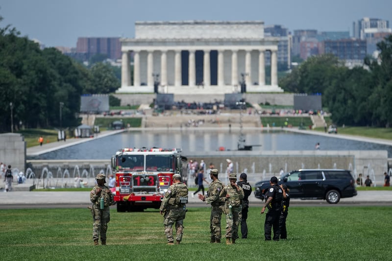 Authorities work near the Lincoln Memorial Reflecting Pool after they responded to what appeared to be a large tracing of the term 8647 into the grounds of the National Mall in Washington, D.C., U.S., June 11, 2026. The arrangement of the numbers was clearly an attempt to show 8647, though the 4 was not fully formed. Federal prosecutors on other occasions have said the term could indicate a threat to President Trump, the 47th U.S. president. REUTERS/ Nathan Howard