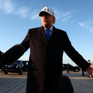 U.S. President Donald Trump speaks to members of the media before boarding Air Force One for travel to Florida, at Joint Base Andrews, Maryland, U.S., March 13, 2026. REUTERS/Kevin Lamarque