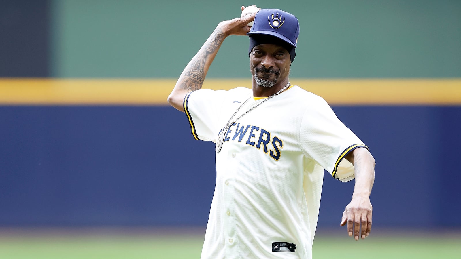 Rapper and producer Snoop Dogg throws out the first pitch before the game between the Milwaukee Brewers vs Cincinnati Reds game.
