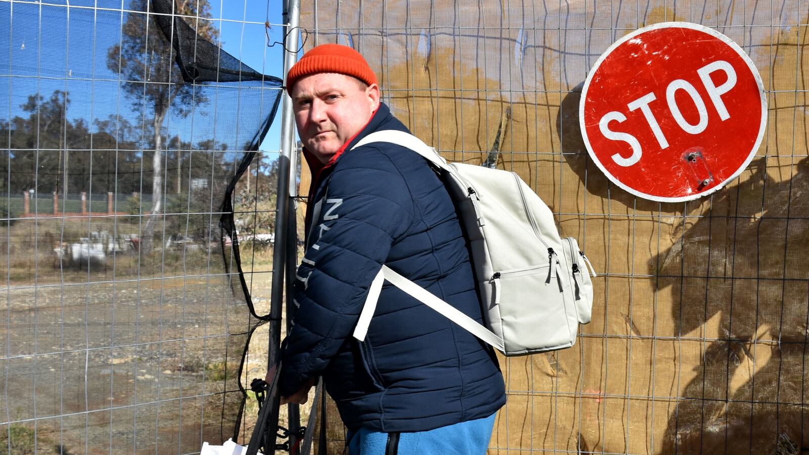 A Russian diplomat leaves a plot of land where Russia’s attempts to build a new embassy near Australia’s parliament suffered a legal blow in Canberra, June 26, 2023.