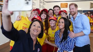 Meghan, Duchess of Sussex and Prince Harry, Duke of Sussex pose for a selfie photo as they meet volunteer first responders from Bondi Surf Bathers' Life Saving Club, during a visit to Bondi Beach, on day four of the royal trip to Australia on April 17, 2026 in Sydney, Australia. Volunteers from the organization, founded in 1907, played an integral role in protecting beachgoers and saving lives during the terrorist attack at Bondi Beach on December 14.