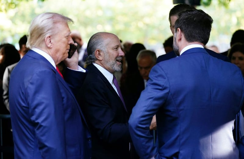 Howard Lutnick, CEO of Cantor Fitzgerald, speaks with President-elect Donald Trump.