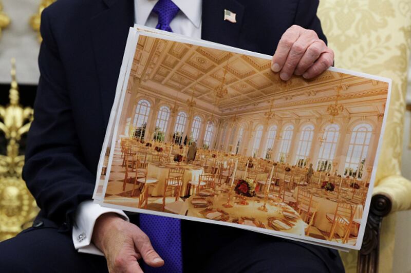 WASHINGTON, DC - OCTOBER 22: U.S. President Donald Trump displays a rendering of his proposed $250 million White House ballroom as he meets with NATO Secretary General Mark Rutte in the Oval Office of the White House on October 22, 2025 in Washington, DC. Less than a week after hosting Ukra