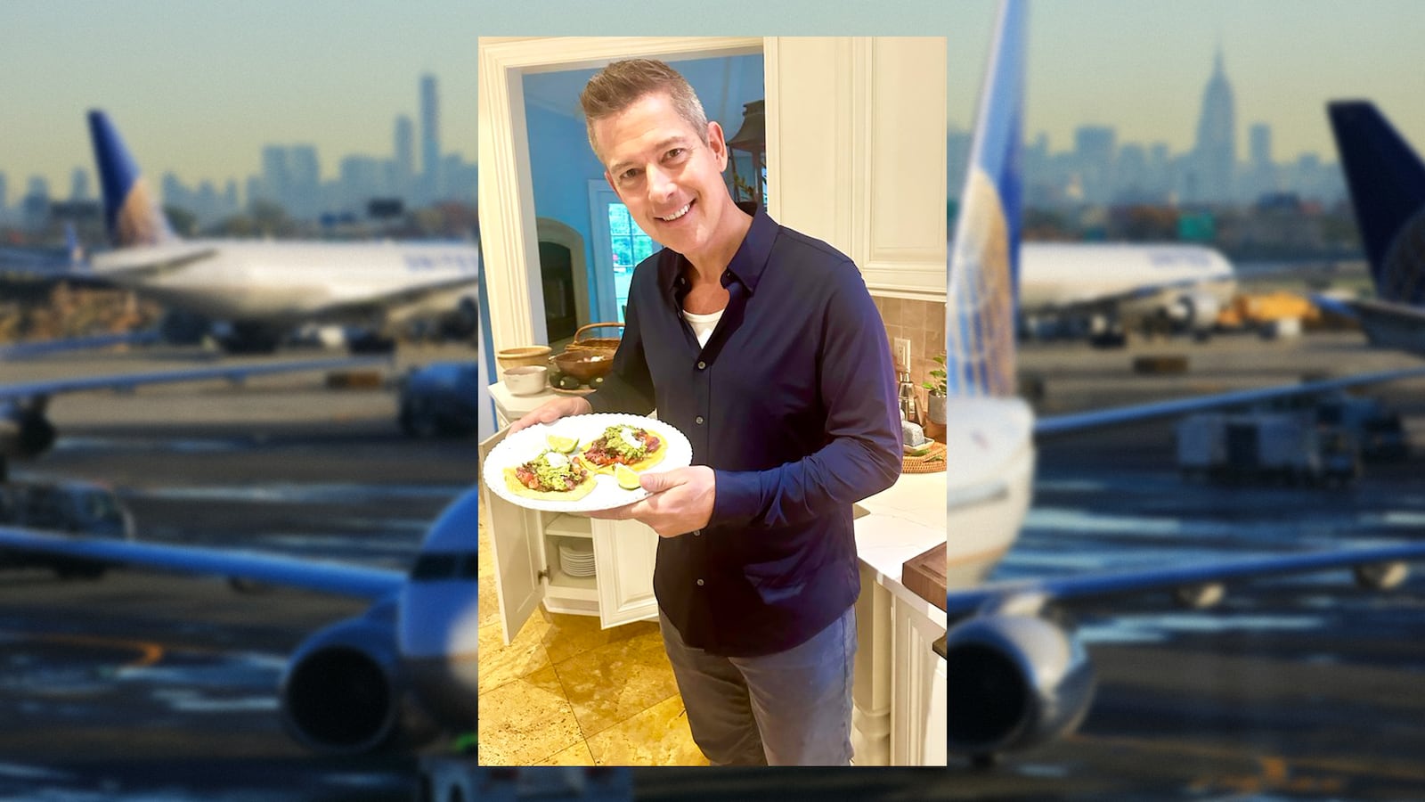 Sean Duffy in a kitchen in front of a white countertop and white wooden cabinets holding a plate with two tacos and a background of United planes at Newark international airport.