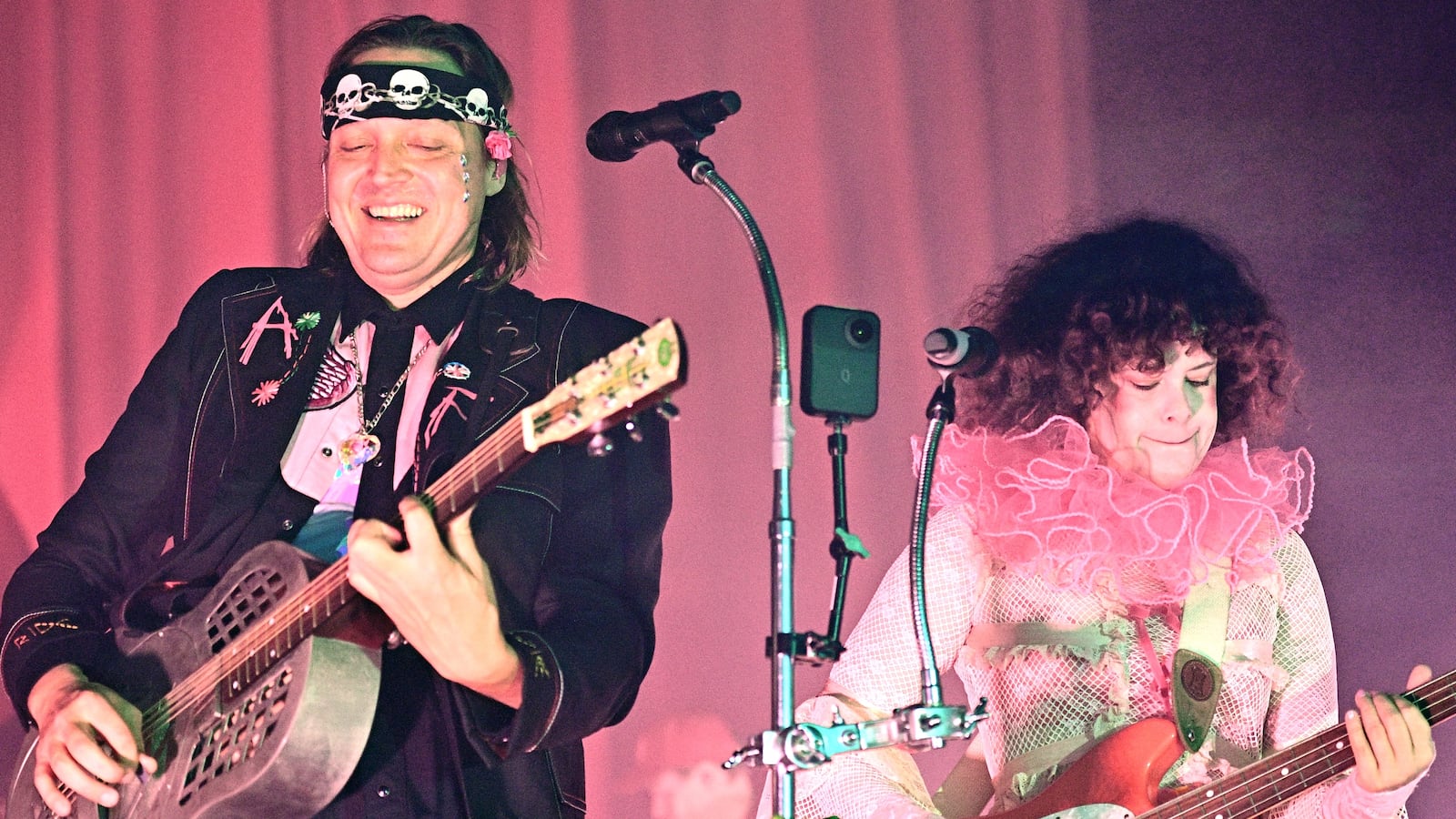LONDON, ENGLAND - MAY 14: Win Butler and Régine Chassagne of Arcade Fire perform on stage during their 'Don't Think About Pink Elephant' world tour at The Royal Albert Hall on May 14, 2025 in London, England. (Photo by Gus Stewart/Redferns)