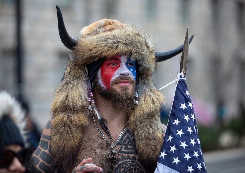 Jacob Chansley, a.k.a. Jake Angeli and the QAnon Shaman, speaks to passersby during the "Stop the Steal" rally on January 06, 2021 in Washington, DC.