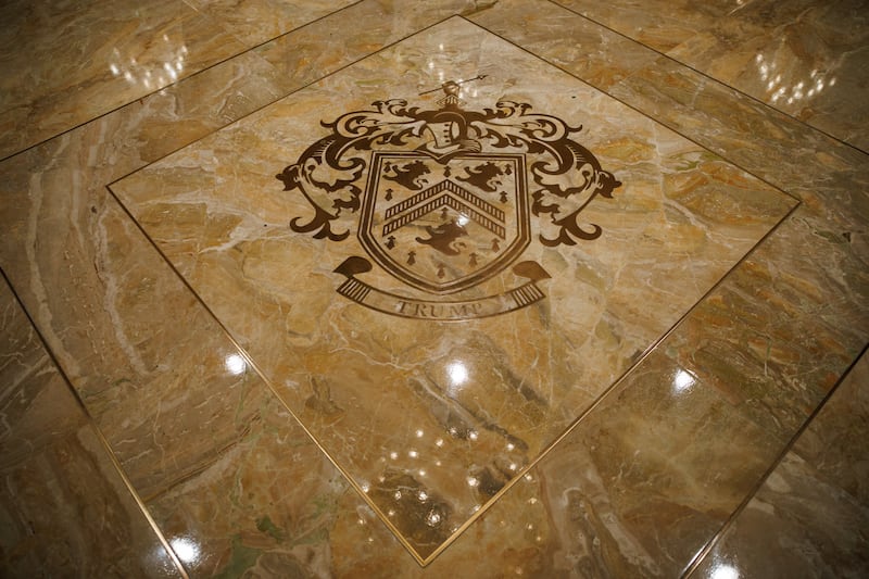 The Trump coat of arms in seen inlaid into the marble of the entrance to the Grand Ballroom at Trump's Mar-a-Lago estate on October 31, 2025 at Palm Beach, Florida.