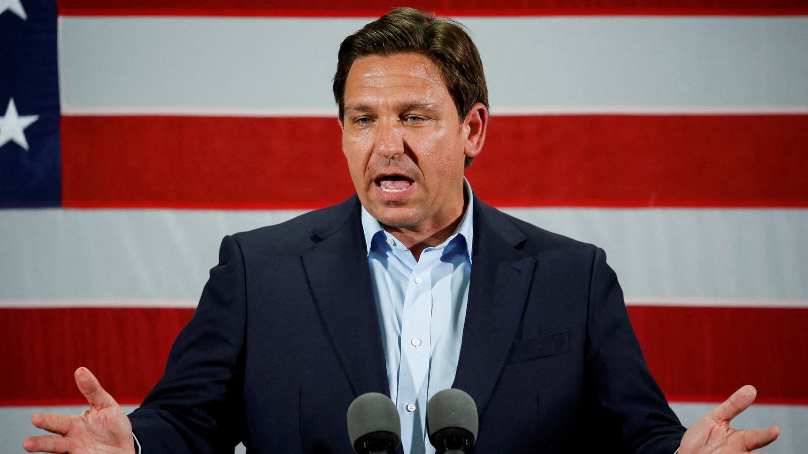 Ron DeSantis speaks in front of a U.S. flag