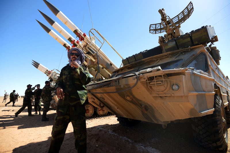 Members of the Sahrawi People's Liberation Army take part in a ceremony to mark 40 years after the Sahrawi Arab Democratic Republic (SADR) was proclaimed by the Polisario Front in the disputed territory of Western Sahara on February 26, 2016 at Rabouni Saharawi refugee camp in Southwest Algerian town of Tindouf. - SADR was declared in 1976 by the Polisario Front -- a rebel movement that wants independence for Western Sahara -- which fought a guerrilla war against Rabat's forces before a ceasefire in 1991. (Photo by Farouk Batiche / AFP) (Photo by FAROUK BATICHE/AFP via Getty Images)