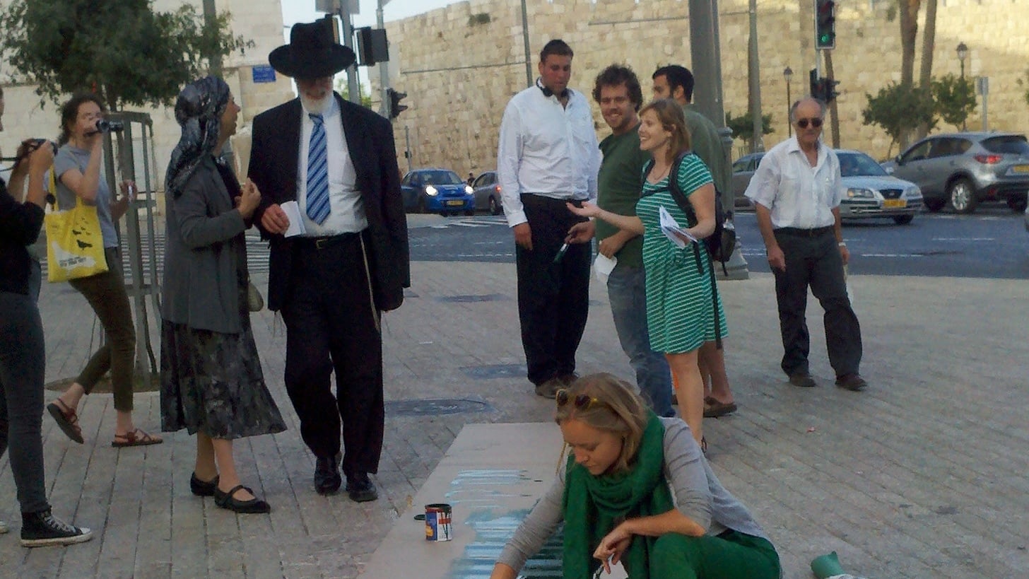 articles/2013/06/05/painting-a-green-line-through-jerusalem4/green-line-painting-openz_rmz50a