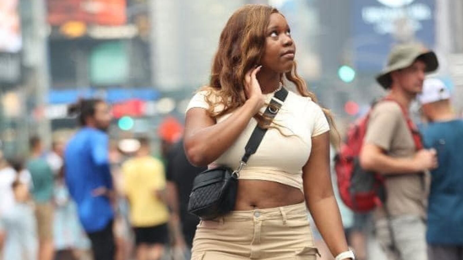 Carlee Russell walks through Times Square, New York.