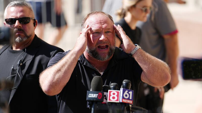 WATERBURY, CONNECTICUT - SEPTEMBER 21: InfoWars founder Alex Jones speaks to the media outside Waterbury Superior Court during his trial on September 21, 2022 in Waterbury, Connecticut. Jones is being sued by several victims' families for causing emotional and psychological harm after they lost their children in the Sandy Hook massacre. A Texas jury last month ordered Jones to pay $49.3 million to the parents of 6-year-old Jesse Lewis, one of 26 students and teachers killed in the shooting in Newtown, Connecticut.