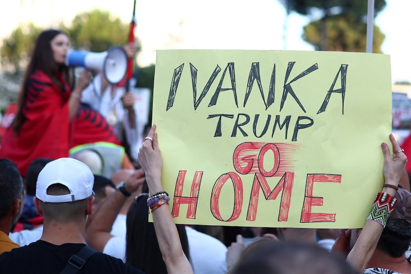Demonstrators holds banners as they protest against a luxury resort a plan by a company linked with Donald Trump's son-in-law Jared Kushner in a protected area, in Tirana , Albania, June 2, 2026.
