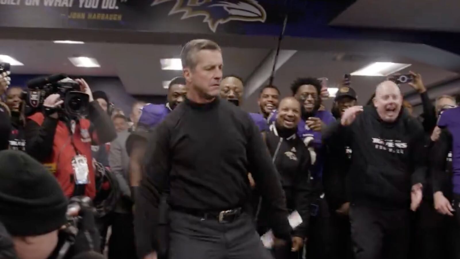 Baltimore Ravens coach John Harbaugh dancing.