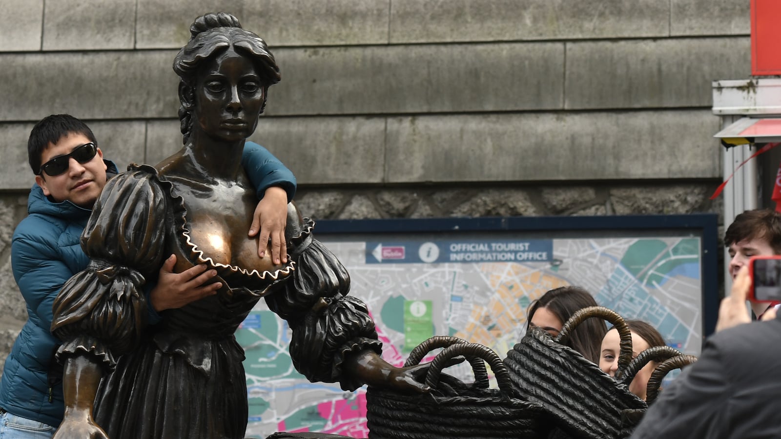 A tourist takes a photo with Molly Malone statue on the opening day of St Patrick's Day Festival.
On Friday, March 15, 2019, in Dublin, Ireland.