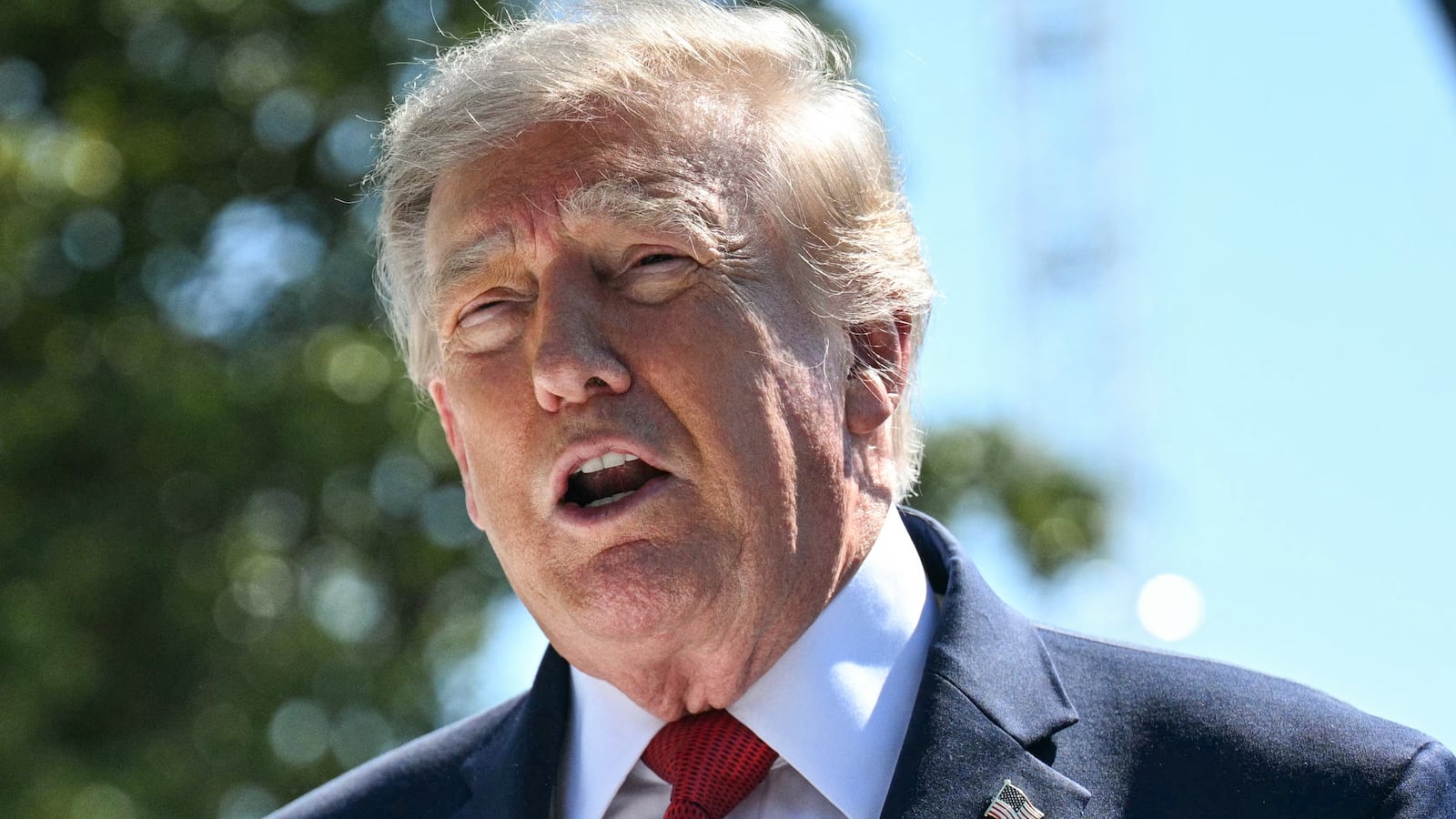 US President Donald Trump speaks to the press about ongoing construction of a helipad and other projects on the South Lawn of the White House in Washington, DC, on August 19, 2026.