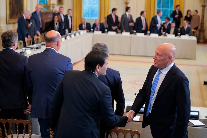 Secretary of State Marco Rubio (C) greets founder and CEO of Armstrong Oil and Gas, Bill Armstrong, as he arrives to a meeting with oil and gas executives in the East Room.