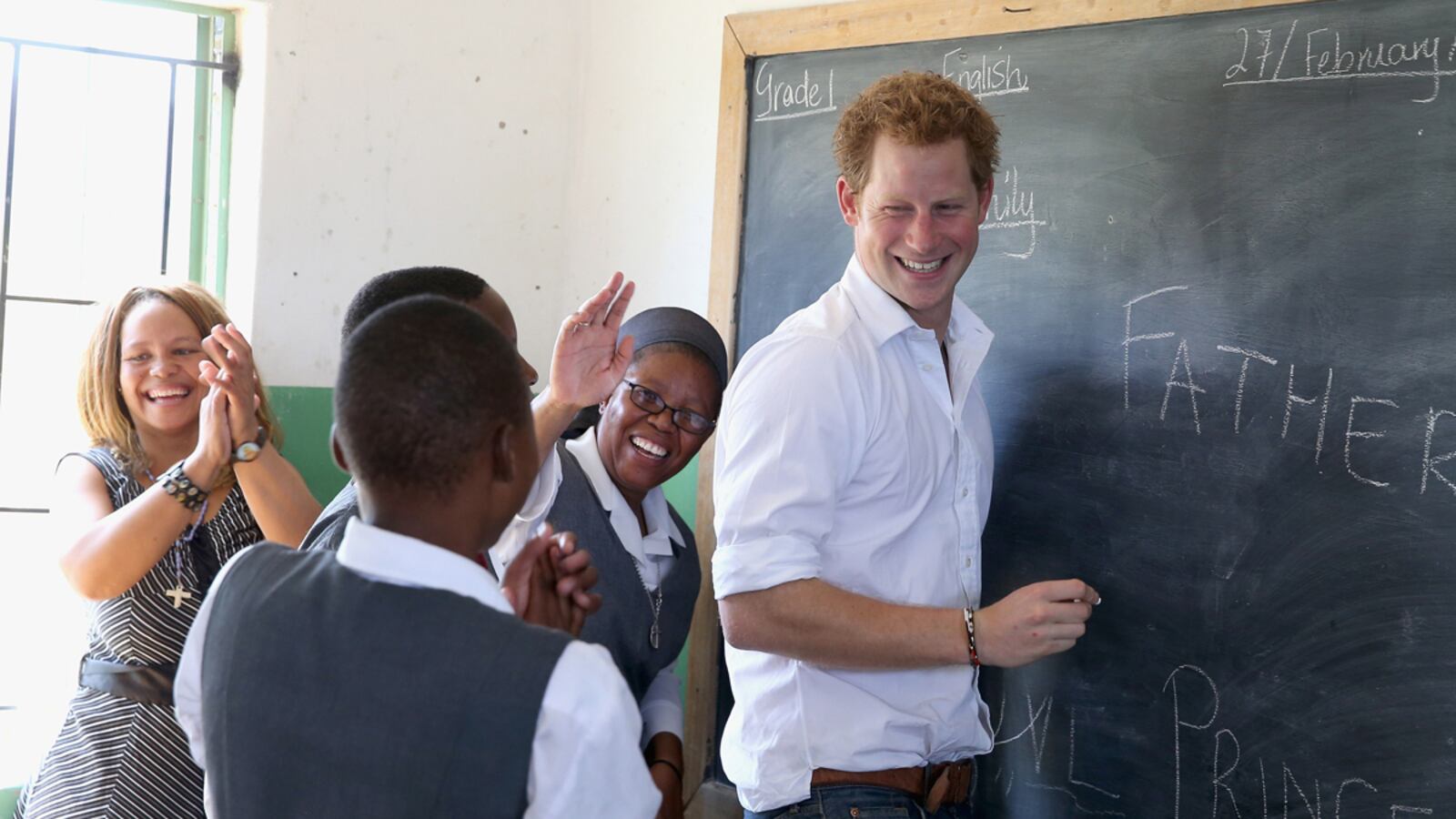 articles/2013/02/27/photos-prince-harry-kids-around-in-lesotho/harry-lesotho3_kry7oj