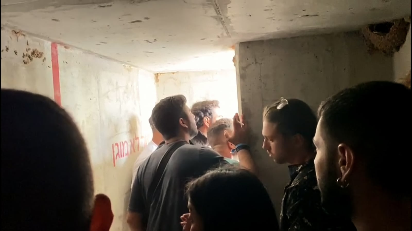 A group seeks safety inside a bomb shelter in the documentary feature 'We Will Dance Again'