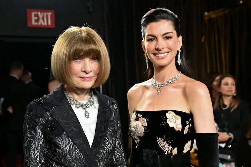 Anna Wintour and Anne Hathaway pose backstage during the Oscars show at the 98th Academy Awards in Hollywood, Los Angeles, California, U.S., March 15, 2026