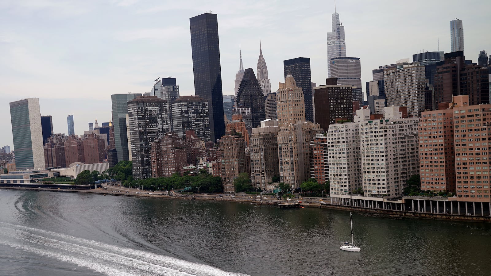 A boat passes by Manhattan.