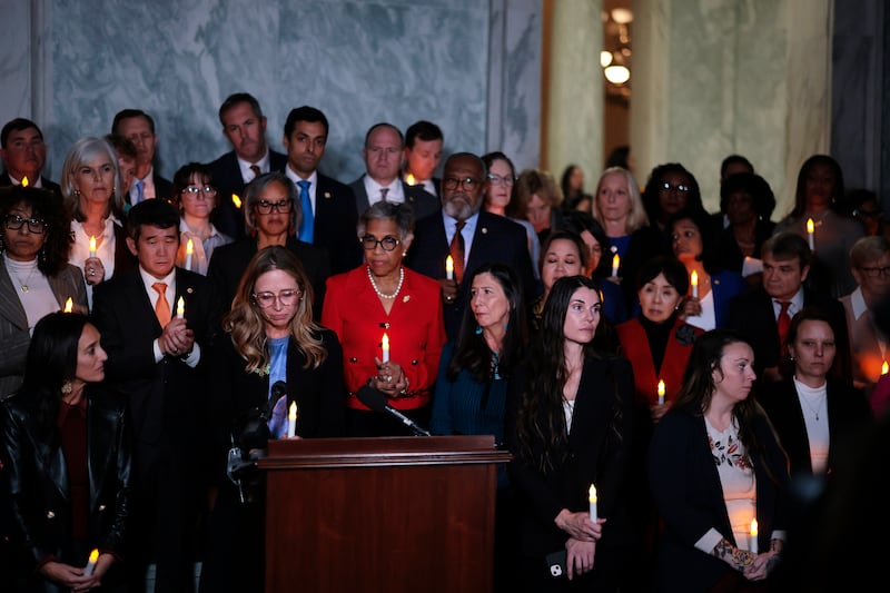 Epstein abuse survivors and Congressional lawmakers attend a bipartisan vigil hosted by the Democratic Women's Caucus on November 18, 2025.