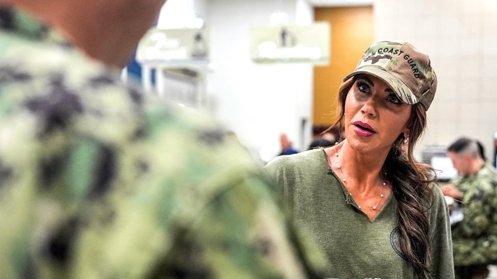 US Homeland Security Secretary Kristi Noem helps serve sailors and coast guardsmen at Naval Support Activity Bahrain