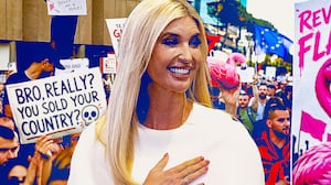 Ivanka Trump in front of protesters.