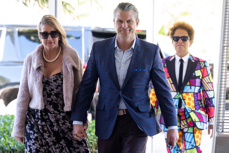 Secretary of Defense Pete Hegseth and his wife, Jennifer Rauchet, arrive to attend the wedding of Dan Scavino, White House Deputy Chief of Staff, and Erin Elmore, the Department of State Director of Art in Embassies, at Mar-a-Lago in Palm Beach, Florida, February 1, 2026.