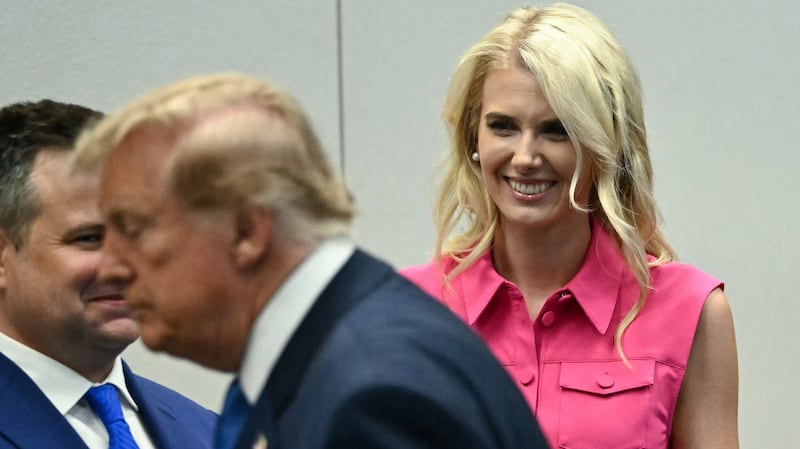 Natalie Harp, aide to US President Donald Trump, looks on as President Trump visits the Mission Control Center at NASA Lyndon B. Johnson Space Center in Houston, Texas, on August 28, 2026.